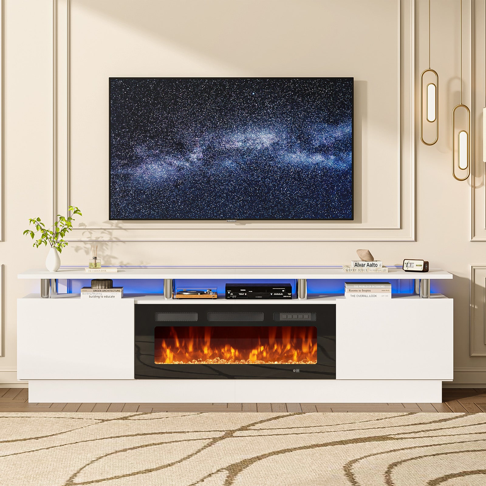 Mounted TV above a white entertainment unit with a long electric fireplace insert, decorative items on shelves.